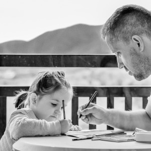 father and daughter learning investments